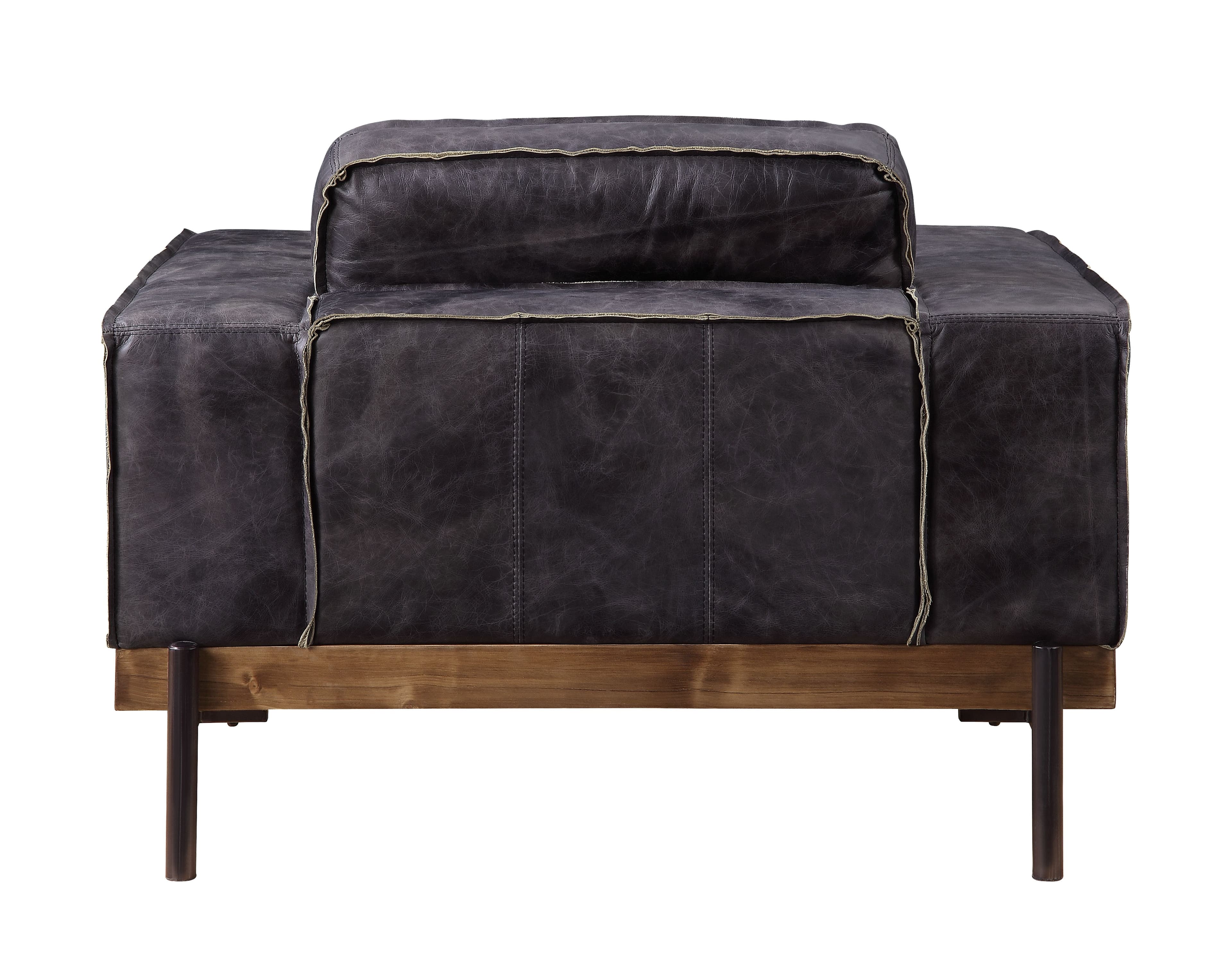 Part of the handsome Silchester Collection, this modern industrial chair will look great in any contemporary space. Contrast stitching makes the antique ebony top grain leather upholstery pop, and highlights the warm color of the wooden trim base. Metal spindle legs visually lighten the substantial proportions of this sofa set. Enjoy wide track arms and comfortable feather and foam seat construction, and relax in style.