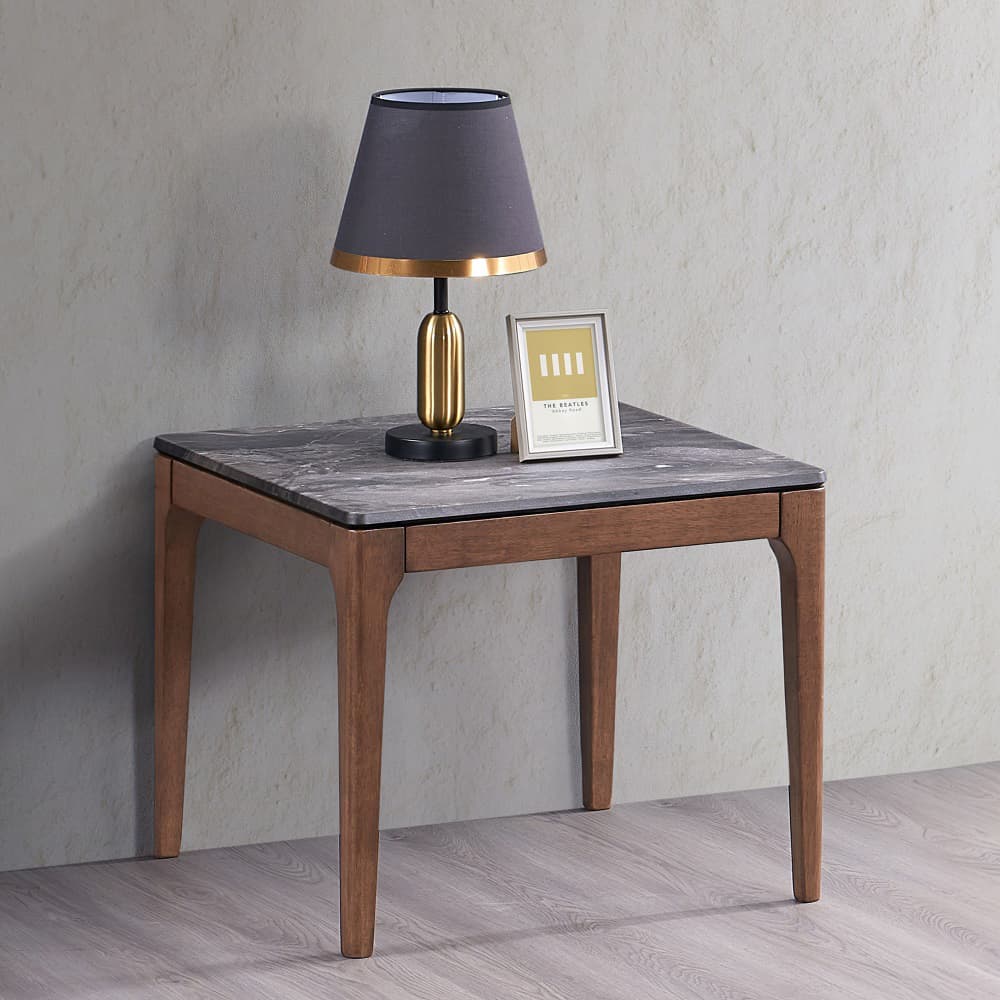 Elevate your living space with the Bevis Collection End Table, where timeless design meets sophisticated elegance. This coffee table pairs an engineered stone surface with the warm tones of a sturdy wooden base, creating a striking visual harmony that commands attention. Perfect for contemporary and traditional settings alike, its expansive top offers ample space for artful displays, casual gatherings, and intimate evenings alike. The Bevis Collection embodies a sense of refined luxury that turns everyday living into an extraordinary experience. Make this exquisite piece the heart of your home, where style and function blend seamlessly.